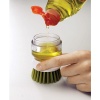 Щетка с дозатором для моющего средства Palm Scrub зеленая - 85004 Joseph Joseph детальная картинка 
